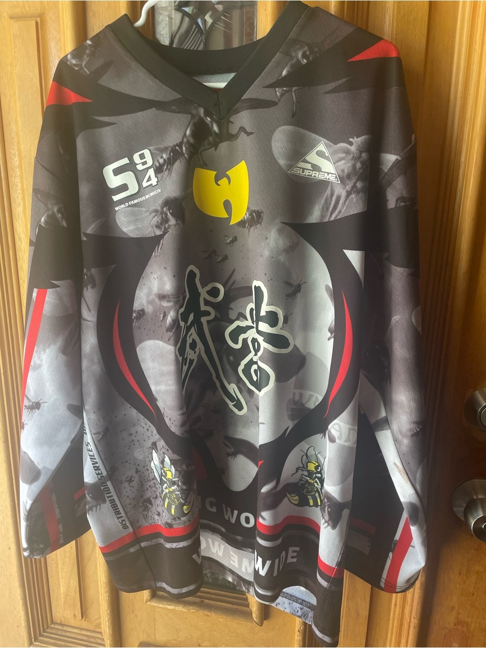Supreme Black, Gray and Red Graphic V-Neck Sweater with Yellow Logo